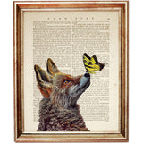 fox looking at a yellow butterfly perched on its nose, printed on an old dictionary page